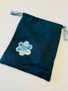 Linen drawstring bag with applique flower